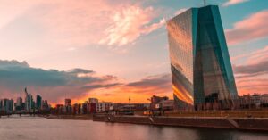 Stunning sunset over Frankfurt's skyline featuring the iconic ECB Tower and Main River.