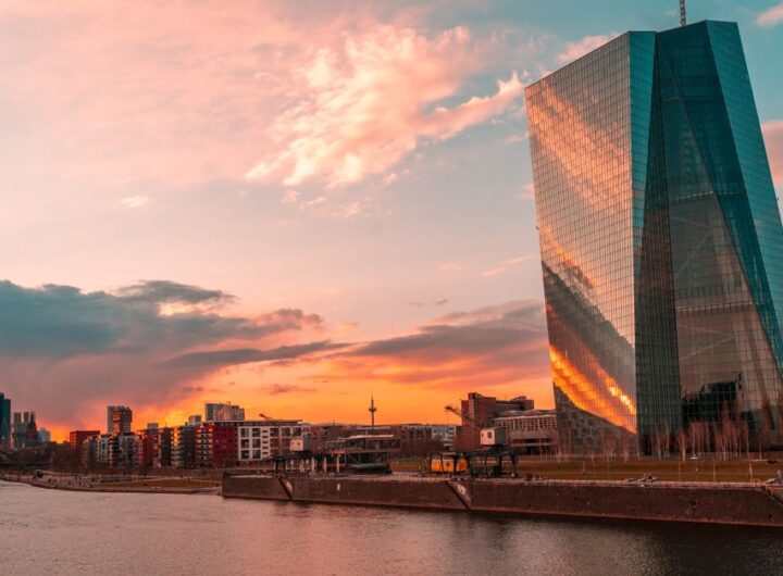 Stunning sunset over Frankfurt's skyline featuring the iconic ECB Tower and Main River.